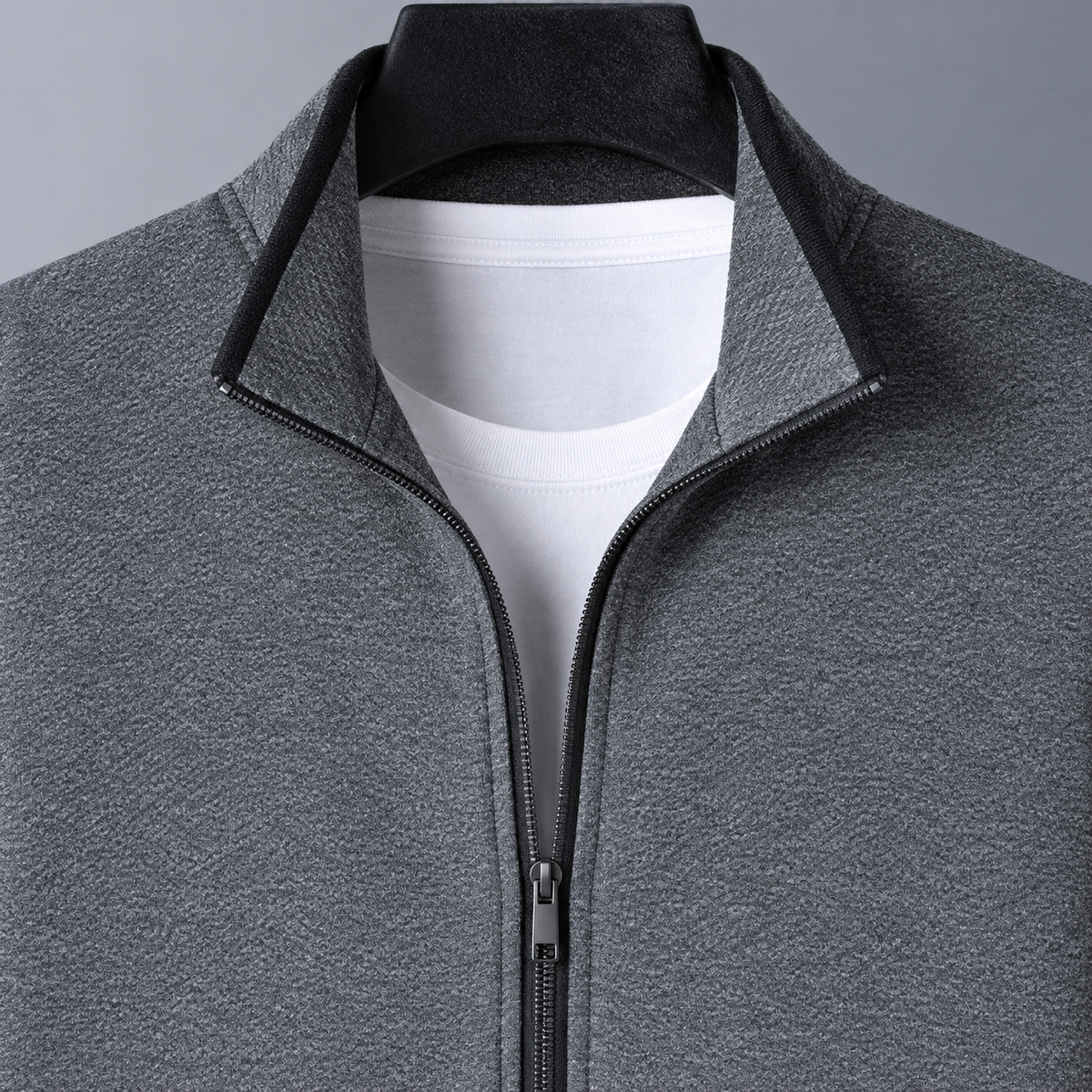 Close view of gray Monza track jacket collar and front zipper