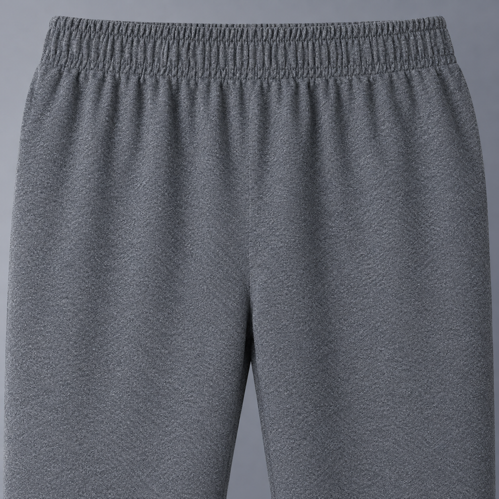 Close view of gray Monza track pants elastic waistband